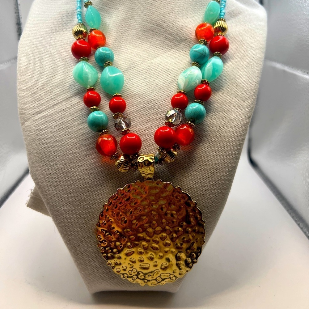 Gold round Medallion pendant with red, orange, blue beads statement necklace